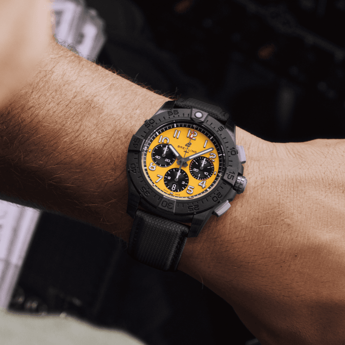 sb0147101i1x2-avenger-b01-chronograph-44-night-mission-on-wrist.png