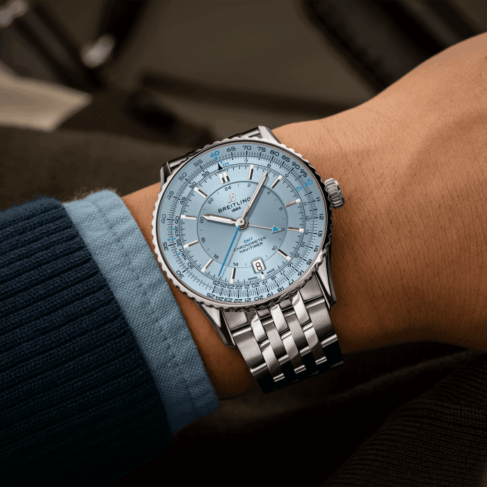 navitimer-41-gmt-a32310171c1a1-ice-blue-metal-bracelet-wrist-shot-ecom.png